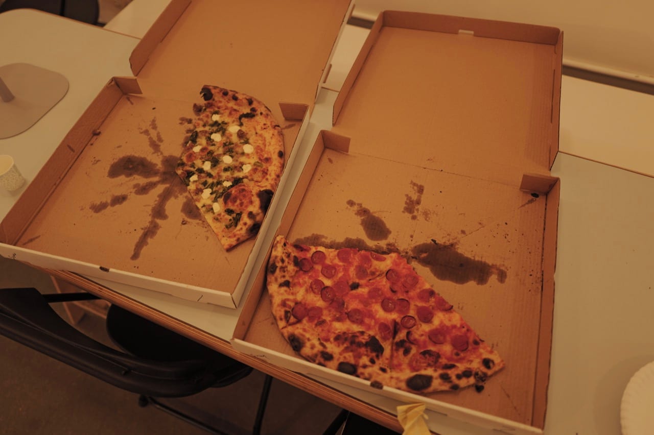 Open pizza boxes ready for attendees.