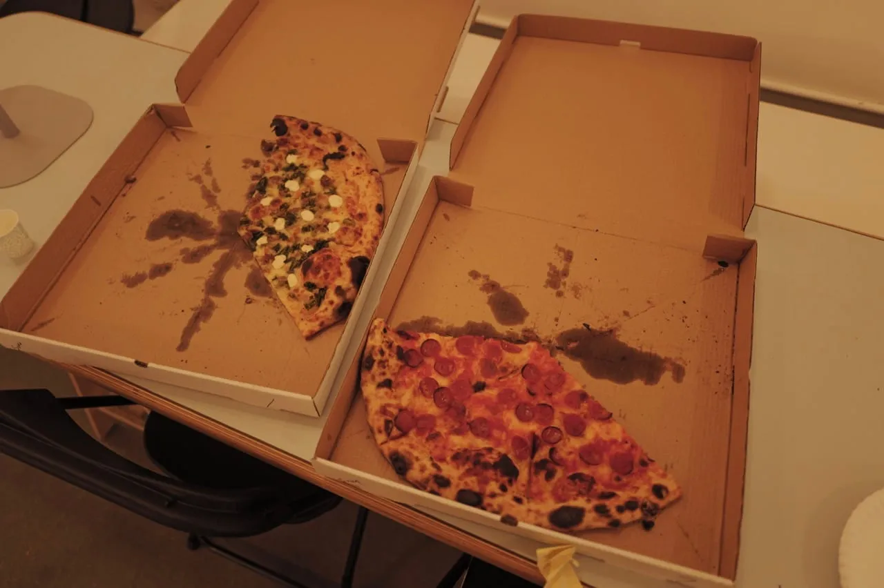 Open pizza boxes ready for attendees.