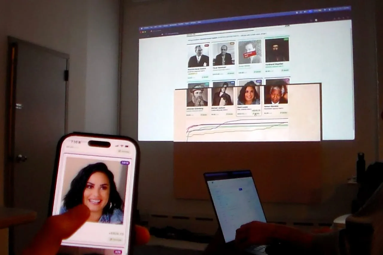 A phone held up beside a projected portrait during a demo.