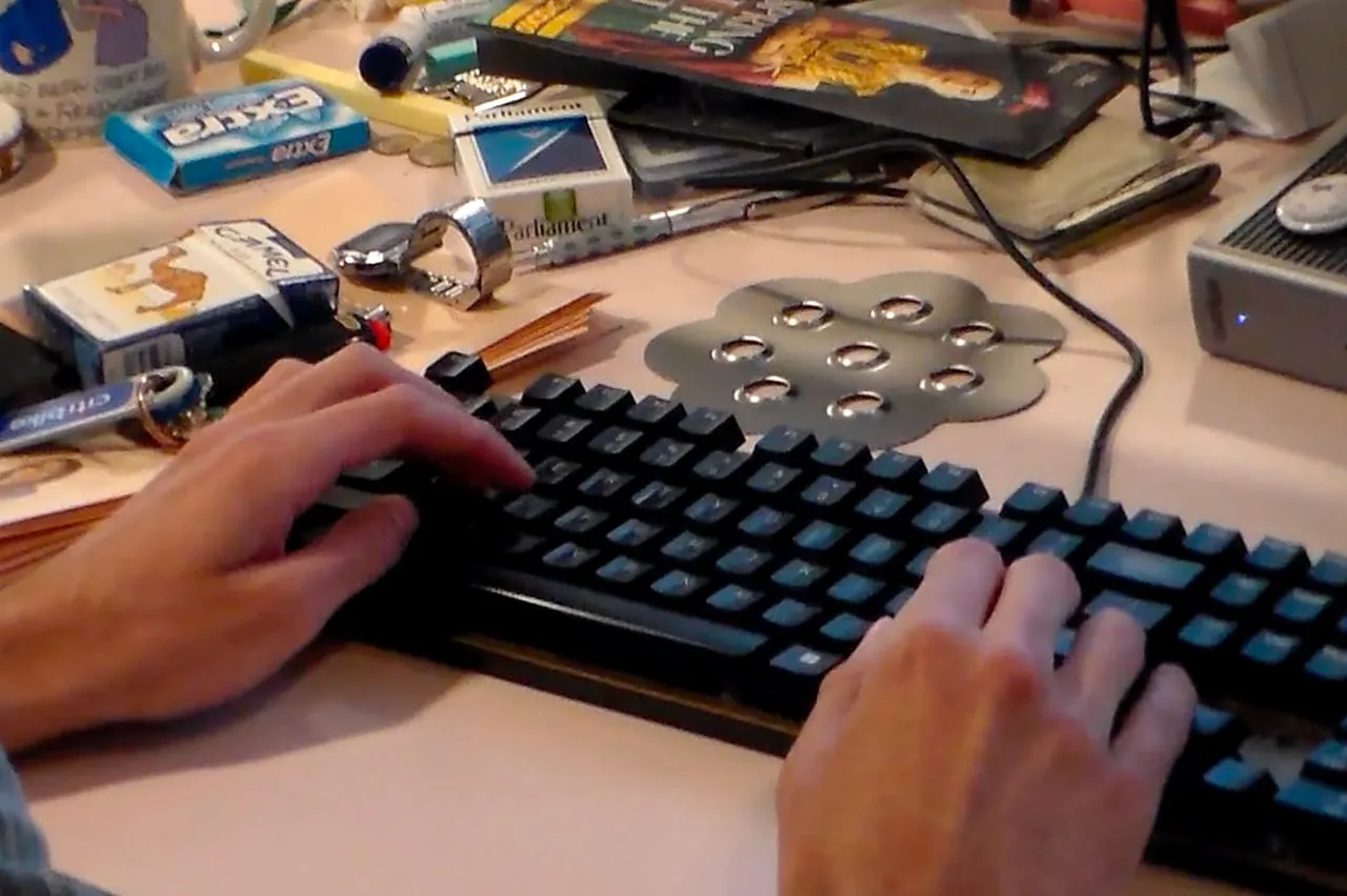 Hands at work on a keyboard during the hackathon.