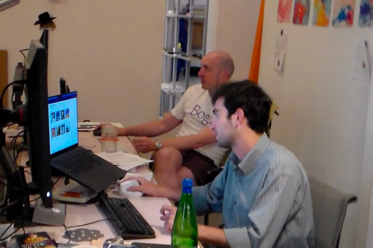 Two participants collaborating at a workstation.
