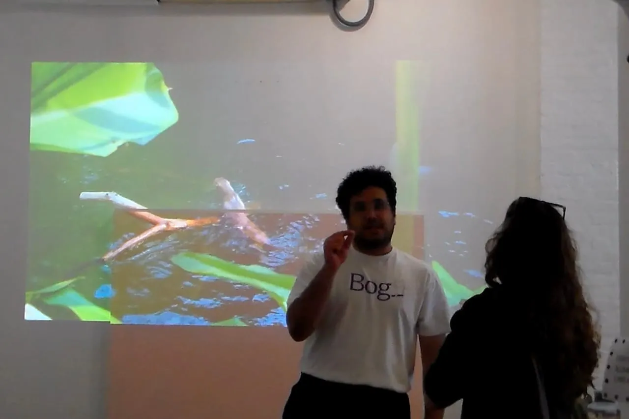 A speaker addressing an attendee after his presentation.
