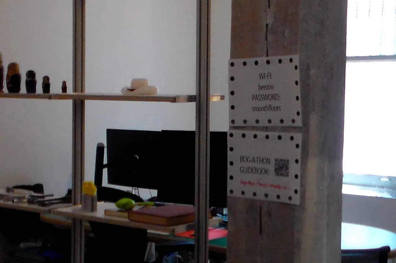 A hand-lettered Bogathon sign at the office entrance.