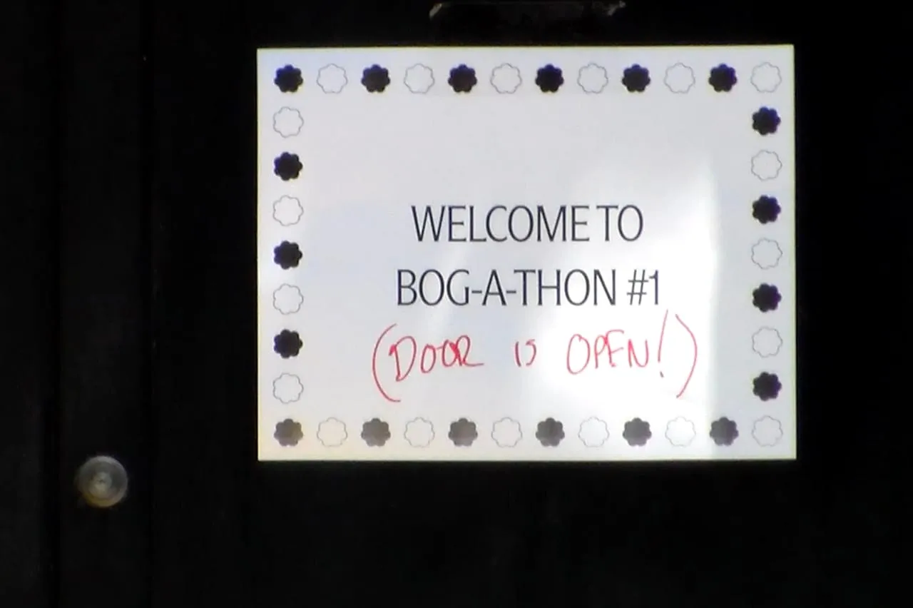 A door sign welcoming guests to Bogathon 1.