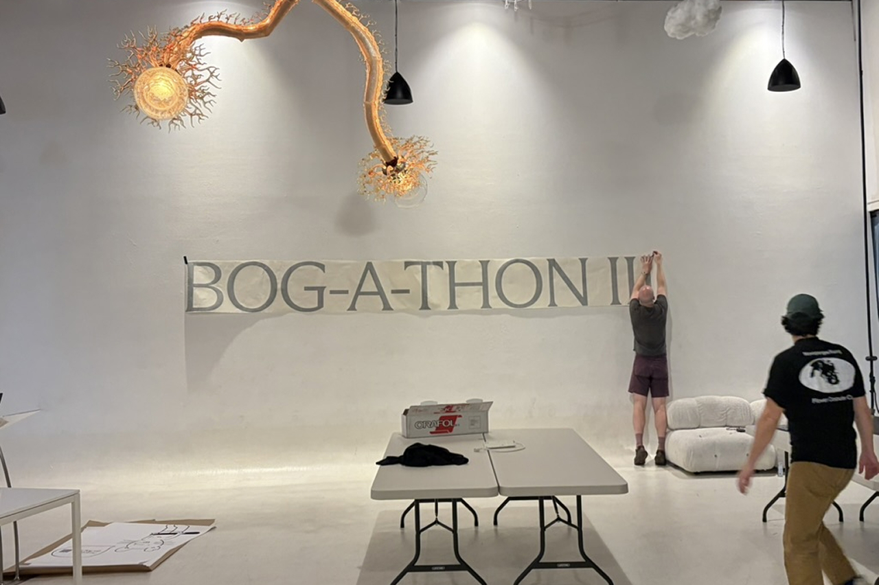 Sam setting up the iconic Bog-a-thon 3 wall vinyl