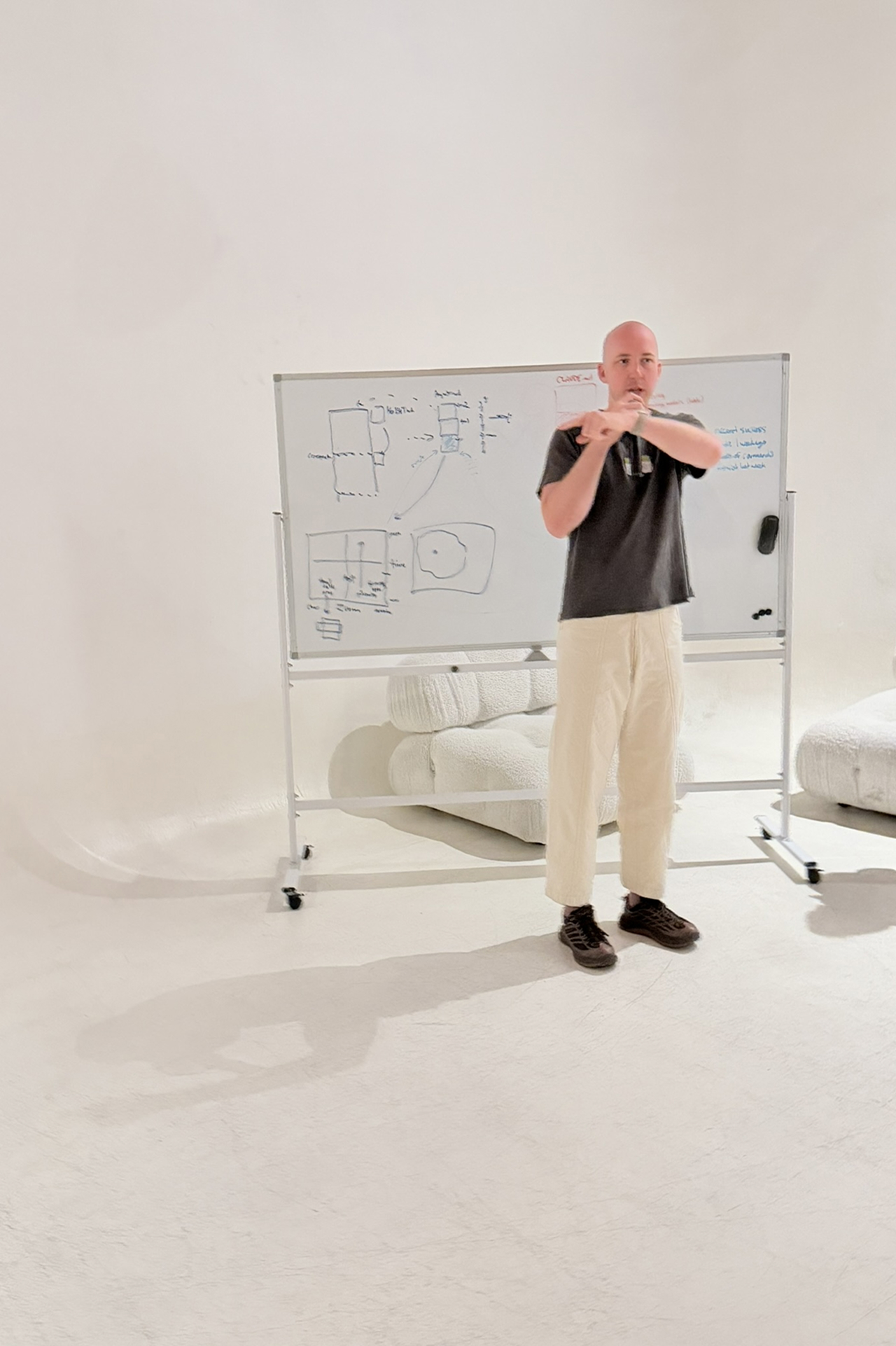 Sam at a whiteboard