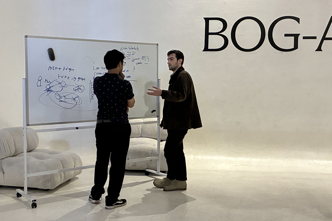 William and a Bog-a-thon participant at a whiteboard