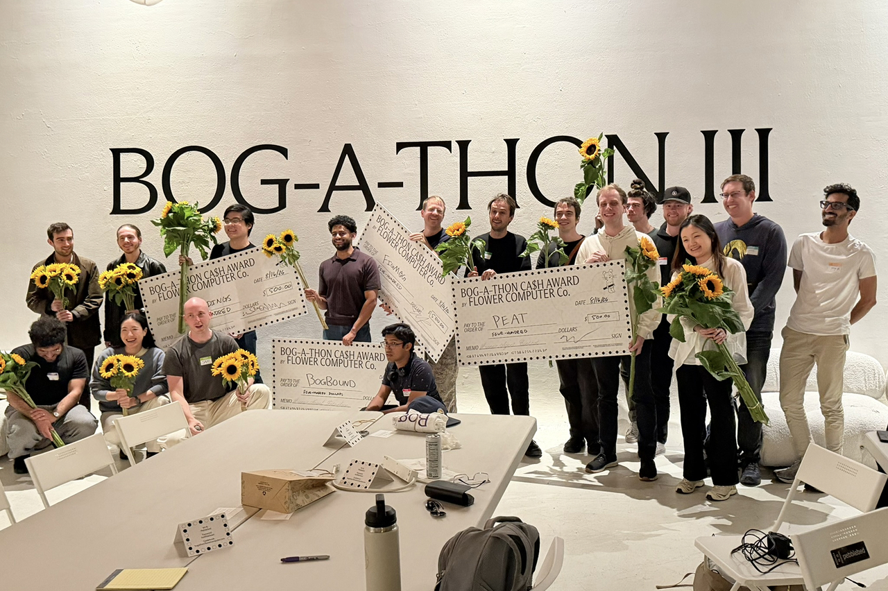 The remaining participants at the end of the event posing for a group photo with Sunflowers and Big Cheques